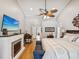 Spacious main bedroom with a fireplace, hardwood floors, and an ensuite bathroom for relaxing and unwinding at 5604 Pine Bay Dr, Tampa, FL 33625