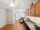 Bright office space with hardwood floors and built in shelving and cabinetry at 5604 Pine Bay Dr, Tampa, FL 33625