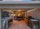 Cozy outdoor kitchen with bar and grill area, seamlessly connecting indoor and outdoor living spaces at 5604 Pine Bay Dr, Tampa, FL 33625