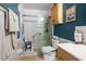 Bright bathroom with a shower, vanity, and nautical-themed decor, creating a cozy and functional space at 5660 80Th N St # B106, St Petersburg, FL 33709
