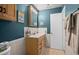 A bright bathroom featuring a double vanity and a separate toilet area at 5660 80Th N St # B106, St Petersburg, FL 33709