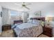 Inviting bedroom featuring a bed, a window with blinds, and nautical decor at 5660 80Th N St # B106, St Petersburg, FL 33709