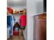 A walk-in closet with shelving, storage, and a glimpse of the bedroom at 5660 80Th N St # B106, St Petersburg, FL 33709
