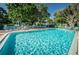 Community pool featuring clear blue water with plenty of seating around the pool deck for residents to enjoy and relax at 5660 80Th N St # B106, St Petersburg, FL 33709