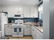 Functional kitchen with stainless steel appliances and ample counter space, offering a practical cooking area at 5660 80Th N St # B106, St Petersburg, FL 33709