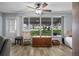 Bright living room featuring a large window overlooking a well-maintained front yard at 5660 80Th N St # B106, St Petersburg, FL 33709