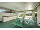 An outdoor kitchen includes a built-in grill, prep area, fridge and ample seating for casual dining and entertaining guests at 5660 80Th N St # B106, St Petersburg, FL 33709