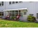 Cozy patio space with comfortable rocking chairs and a charming awning to provide shade and enhance outdoor living at 5660 80Th N St # B106, St Petersburg, FL 33709