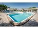Community pool featuring crystal-clear water, sundeck area, lounge chairs and landscaping at 5660 80Th N St # B106, St Petersburg, FL 33709