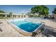 Bright community pool featuring crystal-clear water, sundeck area and mature landscaping at 5660 80Th N St # B106, St Petersburg, FL 33709