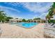 Large community swimming pool with ample lounge seating and a smaller wading pool at 5660 80Th N St # B106, St Petersburg, FL 33709