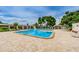 Community swimming pool with lounge chairs at 5660 80Th N St # B106, St Petersburg, FL 33709