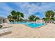 Community swimming pool featuring a wheelchair lift for accessibility at 5660 80Th N St # B106, St Petersburg, FL 33709