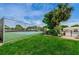 Well-maintained tennis court surrounded by lush landscaping and mature shade trees at 5660 80Th N St # B106, St Petersburg, FL 33709