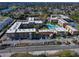Aerial view of the community, showcasing a pool and tennis courts at 5820 N Church Ave # 147, Tampa, FL 33614