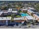 Aerial view of a complex with a community pool and plenty of parking at 5820 N Church Ave # 147, Tampa, FL 33614
