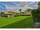 Exterior view of a well-maintained lawn with a community pool at 5820 N Church Ave # 147, Tampa, FL 33614