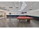 Spacious game room with tables and dart board for entertaining at 5820 N Church Ave # 147, Tampa, FL 33614