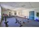 A shared gym features an open layout with various equipment and mirrors at 5820 N Church Ave # 147, Tampa, FL 33614