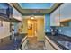 Galley kitchen features modern appliances, stone countertops, and ample cabinet space at 5820 N Church Ave # 147, Tampa, FL 33614