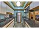 Well-lit kitchen with stainless steel appliances, dark countertops and wood trimmed cabinets at 5820 N Church Ave # 147, Tampa, FL 33614