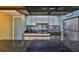 Galley style kitchen featuring granite countertops and modern appliances at 5820 N Church Ave # 147, Tampa, FL 33614