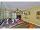Cozy living room with hardwood floors and sliding glass doors to the lanai at 5820 N Church Ave # 147, Tampa, FL 33614