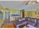 Living room open to kitchen with ceiling fan, tile flooring and a comfortable couch at 5820 N Church Ave # 147, Tampa, FL 33614