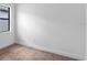 Bedroom featuring wood-look flooring and a bright window at 6072 Silver Grass Ct, Nokomis, FL 34275