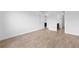 Bedroom boasts a neutral color palette and tile flooring, with a doorway leading to a closet and bathroom at 6072 Silver Grass Ct, Nokomis, FL 34275