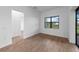 Bright living space with tile floors, white walls, and a large window offering natural light at 6072 Silver Grass Ct, Nokomis, FL 34275