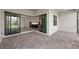Beautiful outdoor patio with brick pavers leading to the open kitchen with stainless steel appliances at 6072 Silver Grass Ct, Nokomis, FL 34275