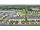 Aerial view showcases community layout with pond, green spaces, and well-maintained townhomes at 6235 Bucket Ct, Gibsonton, FL 33534