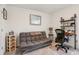 Comfortable space with a futon and sleek desk setup, perfect for work and relaxation at 6235 Bucket Ct, Gibsonton, FL 33534