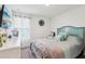 Cozy bedroom with a decorative teal headboard and stylish, nautical-themed décor at 6235 Bucket Ct, Gibsonton, FL 33534