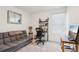 Modern room with a futon, desk, stylish décor, perfect for relaxing and working at 6235 Bucket Ct, Gibsonton, FL 33534