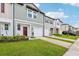 Well-maintained townhomes featuring attached garages and appealing color schemes in a desirable neighborhood at 6235 Bucket Ct, Gibsonton, FL 33534