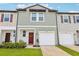 Charming townhome with attached garage, neutral siding, and well-maintained front lawn at 6235 Bucket Ct, Gibsonton, FL 33534