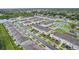 Aerial view of townhomes in a community with ponds and landscaping at 6235 Bucket Ct, Gibsonton, FL 33534