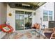 Cozy patio with comfortable seating, a coastal-themed rug, and sliding glass doors for indoor-outdoor living at 6235 Bucket Ct, Gibsonton, FL 33534