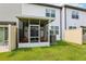 Screened porch featuring outdoor seating, offering a relaxing and pest-free space to enjoy the backyard view at 6235 Bucket Ct, Gibsonton, FL 33534