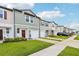 Inviting street view of attractive townhomes with green lawns, garages, and well-maintained landscaping at 6235 Bucket Ct, Gibsonton, FL 33534