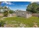 Backyard featuring a storage shed, a well-manicured lawn, and a wood fence creating a private space at 6944 80Th N Ave, Pinellas Park, FL 33781