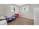 Comfortable bedroom with laminate flooring, two windows, and ample storage at 6944 80Th N Ave, Pinellas Park, FL 33781