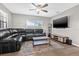 Cozy living room featuring a large sectional sofa, flat screen tv, and recessed lighting at 6944 80Th N Ave, Pinellas Park, FL 33781