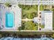 Stunning aerial view of the community's pool and meticulously maintained courtyard area at 701 Poinsettia Rd # 322, Belleair, FL 33756