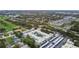 A stunning aerial view highlights the beautiful condo in a picturesque, lush green neighborhood at 701 Poinsettia Rd # 322, Belleair, FL 33756