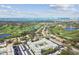 Stunning aerial view showcasing the condo building, lush golf course and waterfront skyline at 701 Poinsettia Rd # 322, Belleair, FL 33756