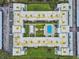 Overhead drone view displaying the community's layout, landscaping, and parking areas at 701 Poinsettia Rd # 322, Belleair, FL 33756