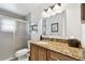 Bathroom features a walk-in shower, granite countertops, and storage at 701 Poinsettia Rd # 322, Belleair, FL 33756